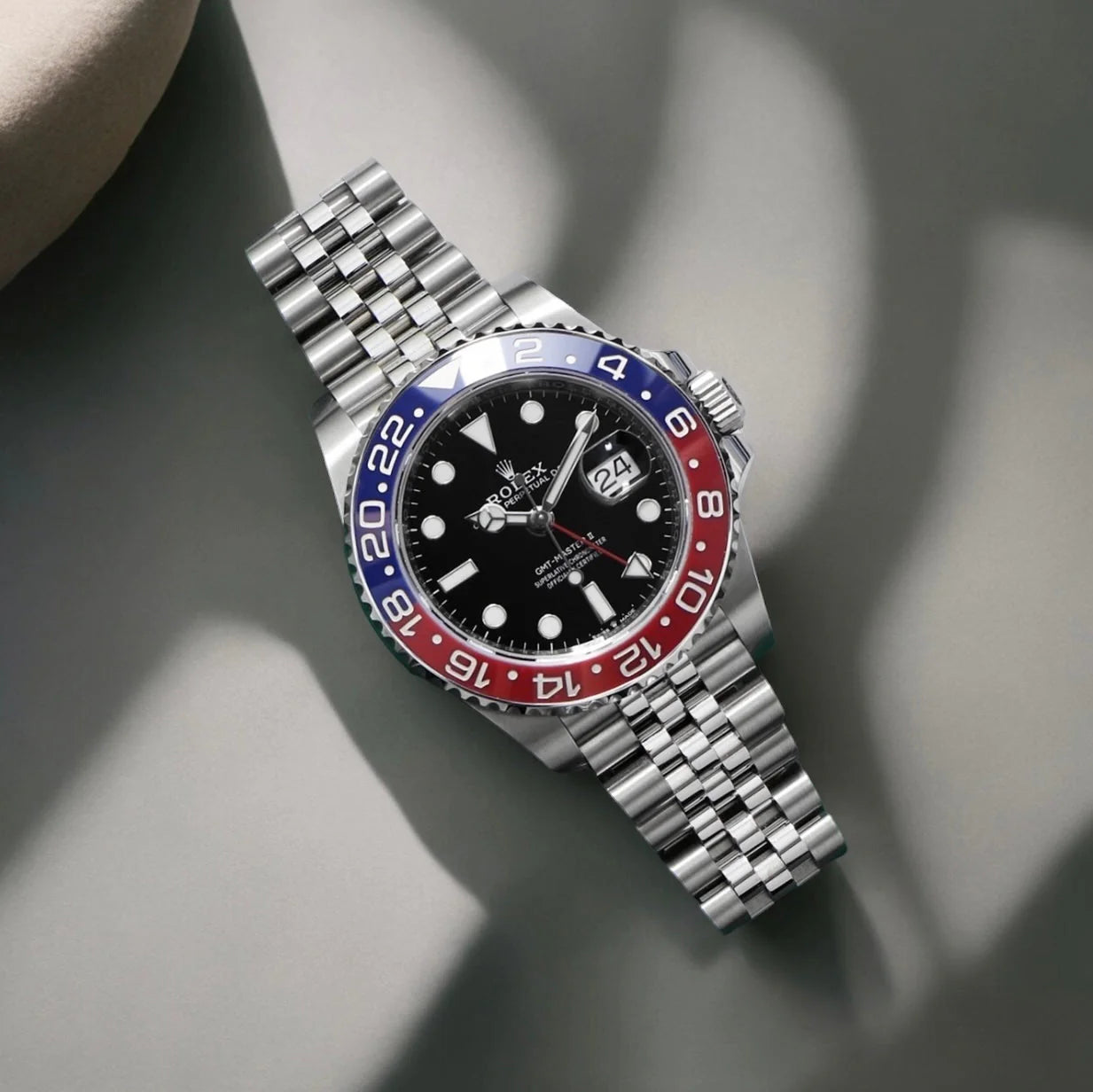 GMT-Master II red and blue Cerachrom bezel black dial and a Jubilee bracelet.