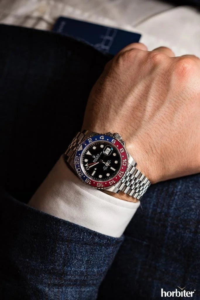 GMT-Master II red and blue Cerachrom bezel black dial and a Jubilee bracelet.